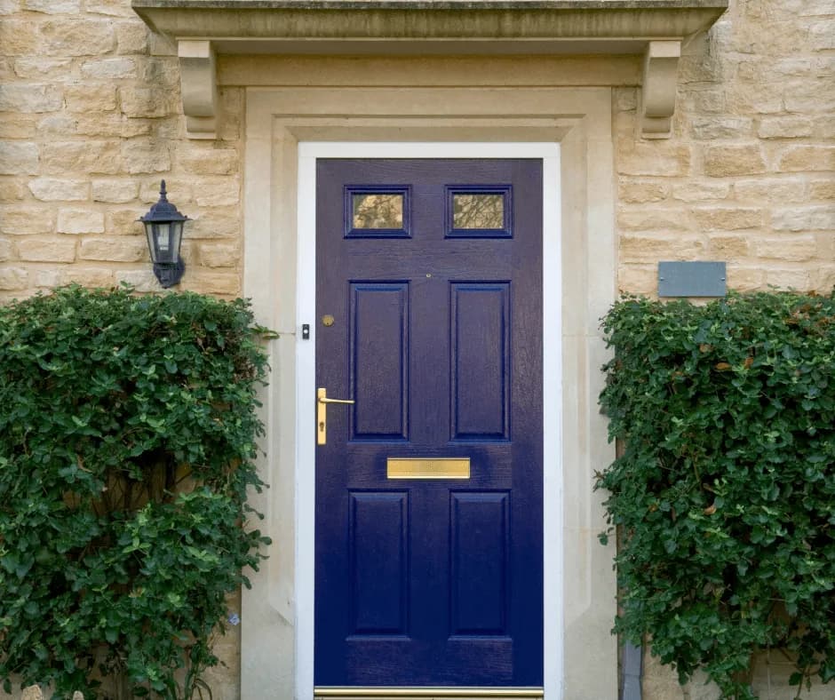 Navy front door of a home